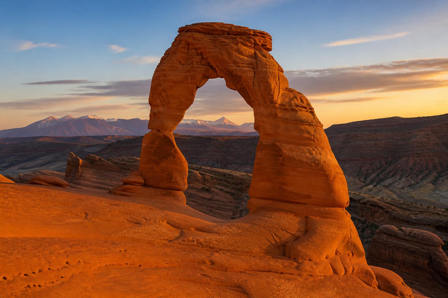 Delicate Arch in Arches National Park, Utah, in a warm terracotta duotone